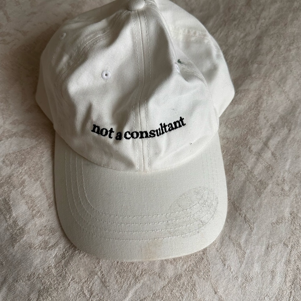 Classic White Baseball Cap with Black 'not a consultant' Embroidery